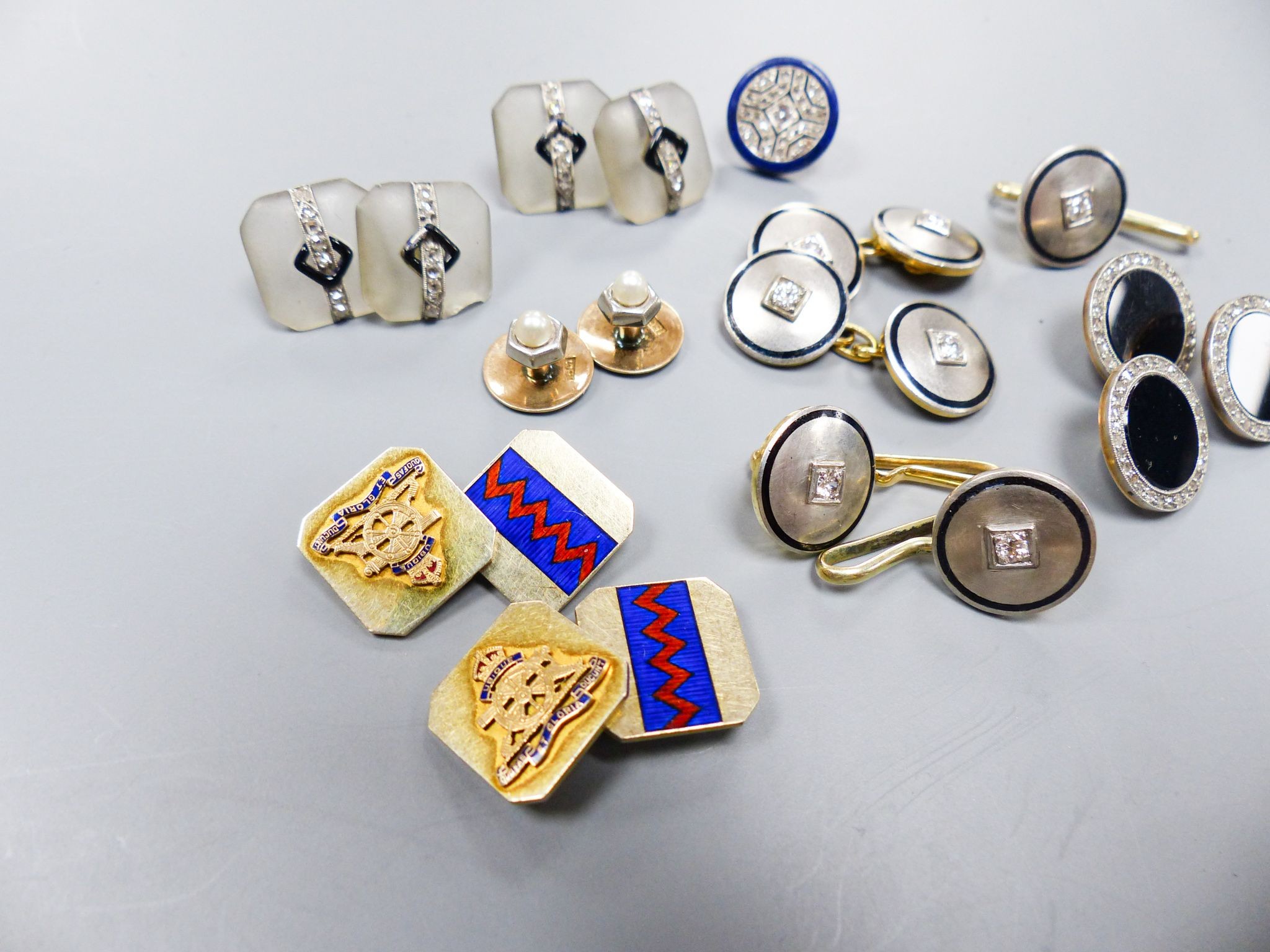 A pair of yellow and white metal, diamond and black enamel cufflinks and three similar dress studs, 11mm, one stamped 14k, gross 21.9 grams, four frosted glass, black enamel and diamond set dress studs(a.f.), two 15ct &